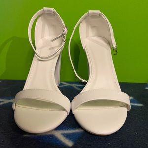 White Pumps with a block heel, only worn to try on.